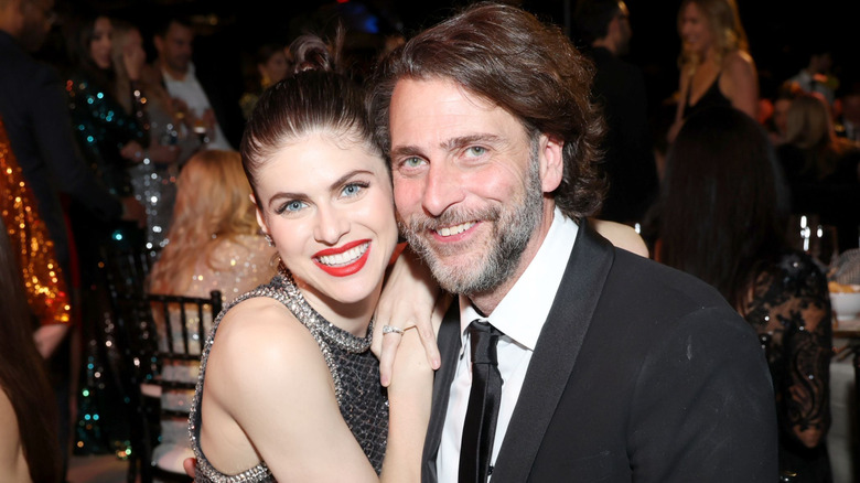 Andrew Form and Alexandra Daddario seated together at a formal dinner