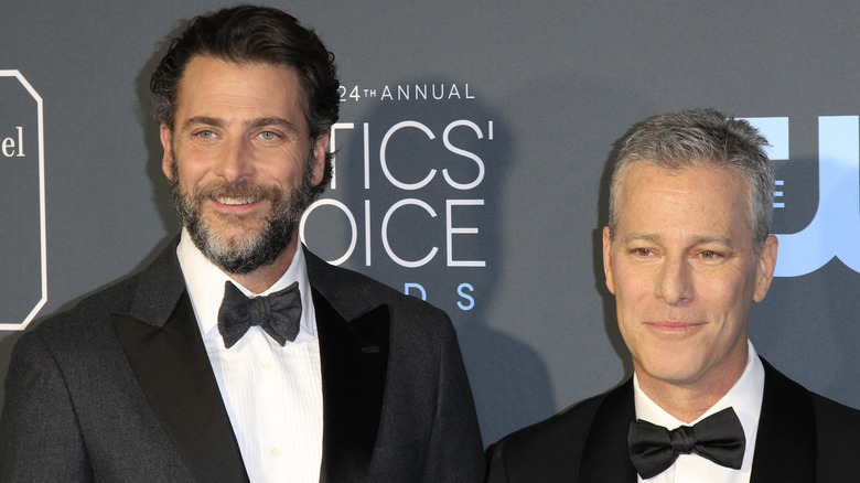 Andrew Form and Brad Fuller on red carpet in tuxedos