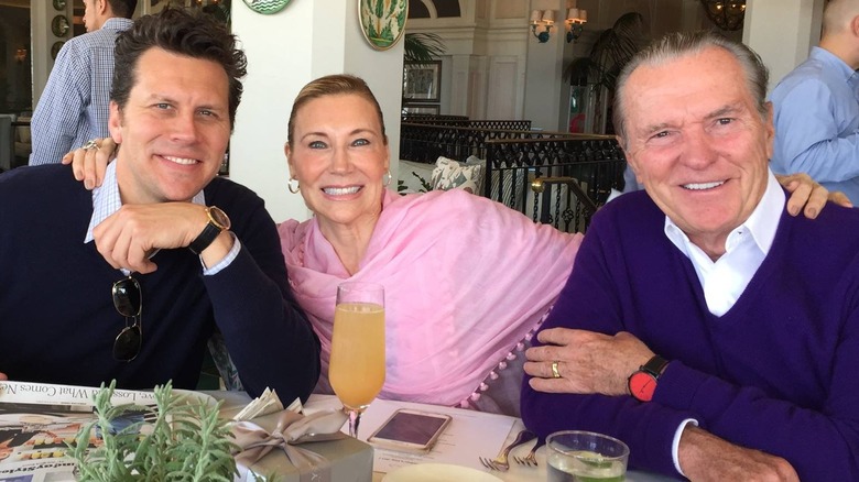 Hayes MacArthur posing with mother Shelley MacArthur and stepfather Bill Farley at table in restaurant