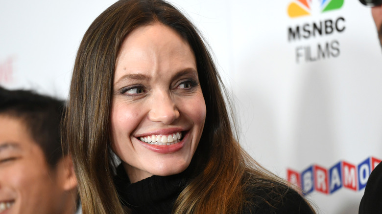 Angelina Jolie smiling looking to side