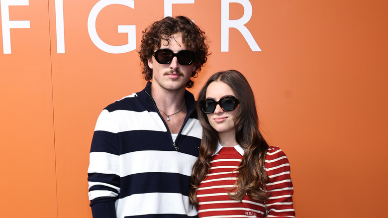 Benson Boone and Maggie Thurmon posing together wearing sunglasses