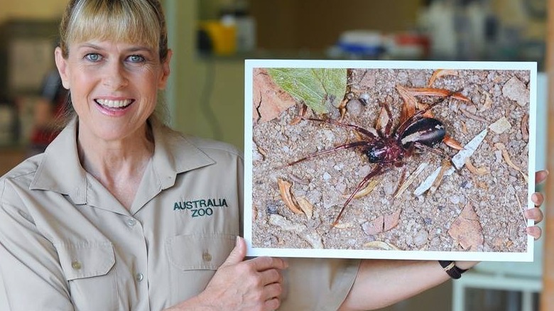 Terri holding a picture of the spider