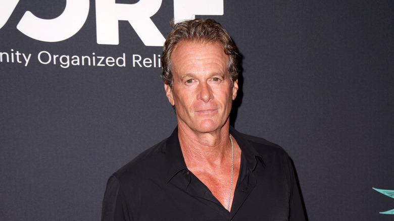 Rande Gerber posing in a black shirt