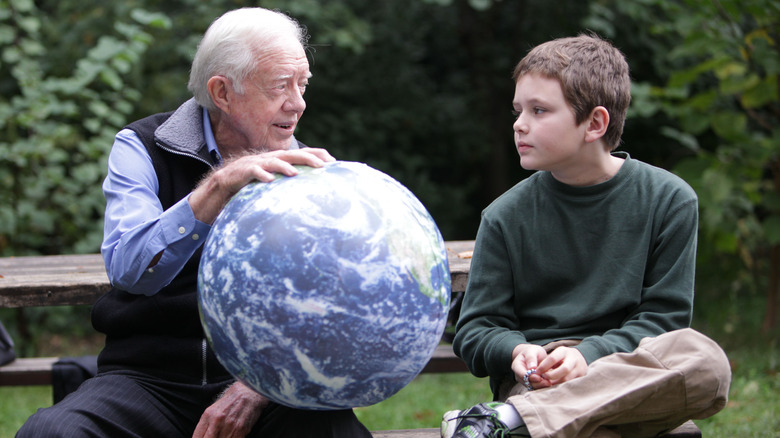 Young Hugo talking to his grandpa Jimmy Carter