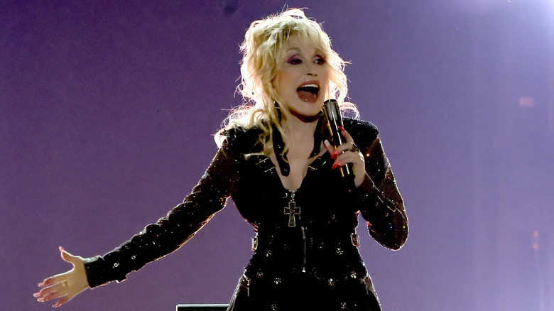 Dolly Parton performing with microphone