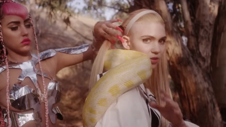 Brooke Candy and Grimes in the music video for Oblivion