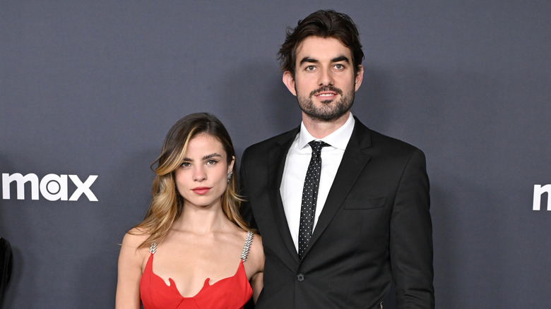 Conor Kennedy and Giulia Be posing at an event