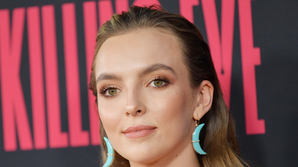 Jodie Comer poses at an event