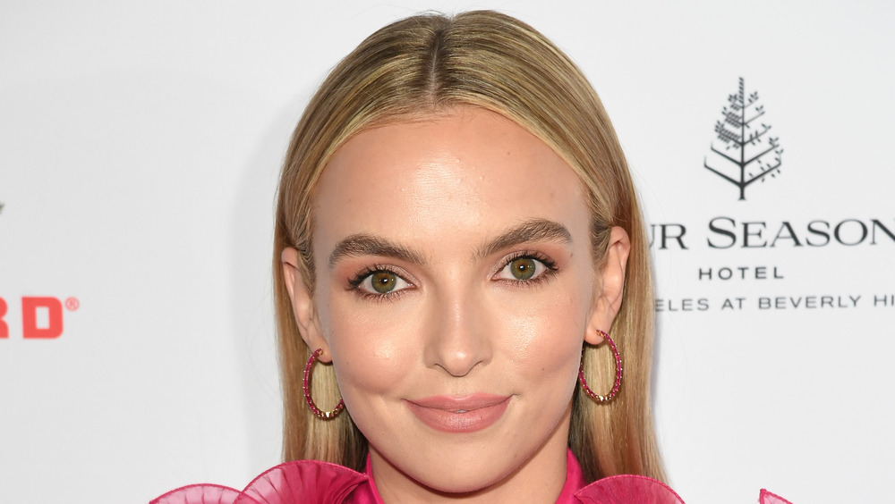 Jodie Comer poses at an event