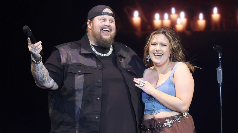 Bailee Ann Deford and Jelly Roll laughing on stage