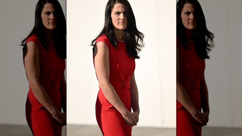 Tatiana Schlossberg frowning in red dress