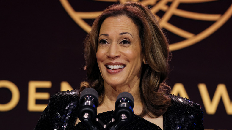 Kamala Harris smiling at podium