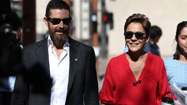 Jeff Halperin and wife Kari Lake walking