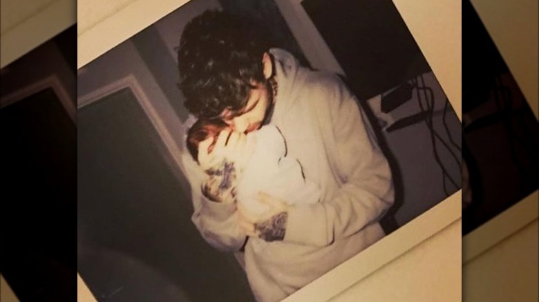 Liam Payne holding newborn son Bear Grey Payne