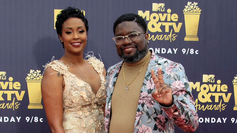 Lil Rel Howery and wife Verina at an event