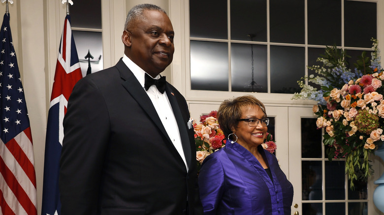 Lloyd Austin and Charlene Austin walking hand in hand