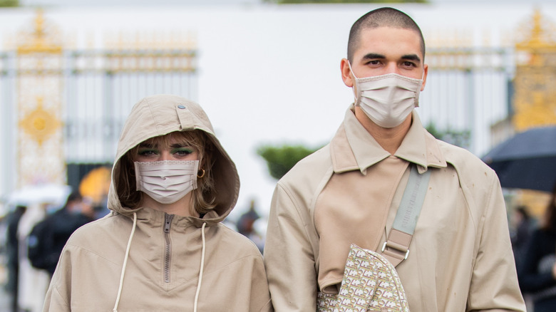 Maisie Williams and boyfriend Reuben Selby outdoors in masks