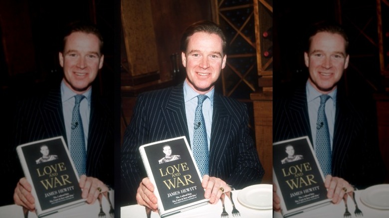 Major James Hewitt holding his book