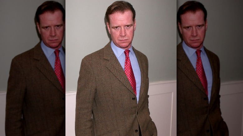 Major James Hewitt frowning