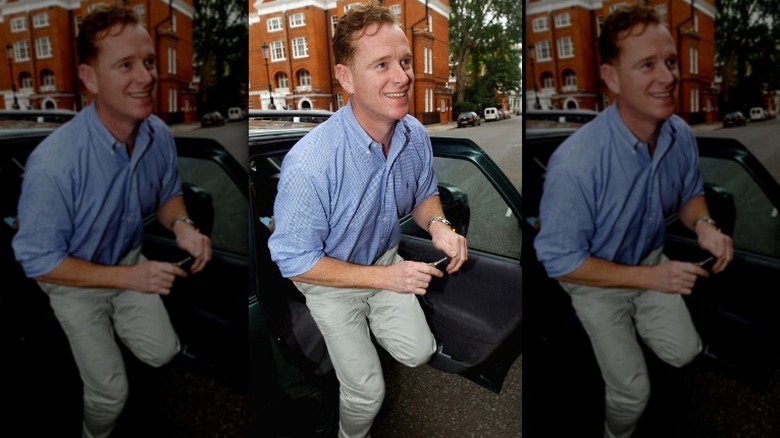 Major James Hewitt leaving a car