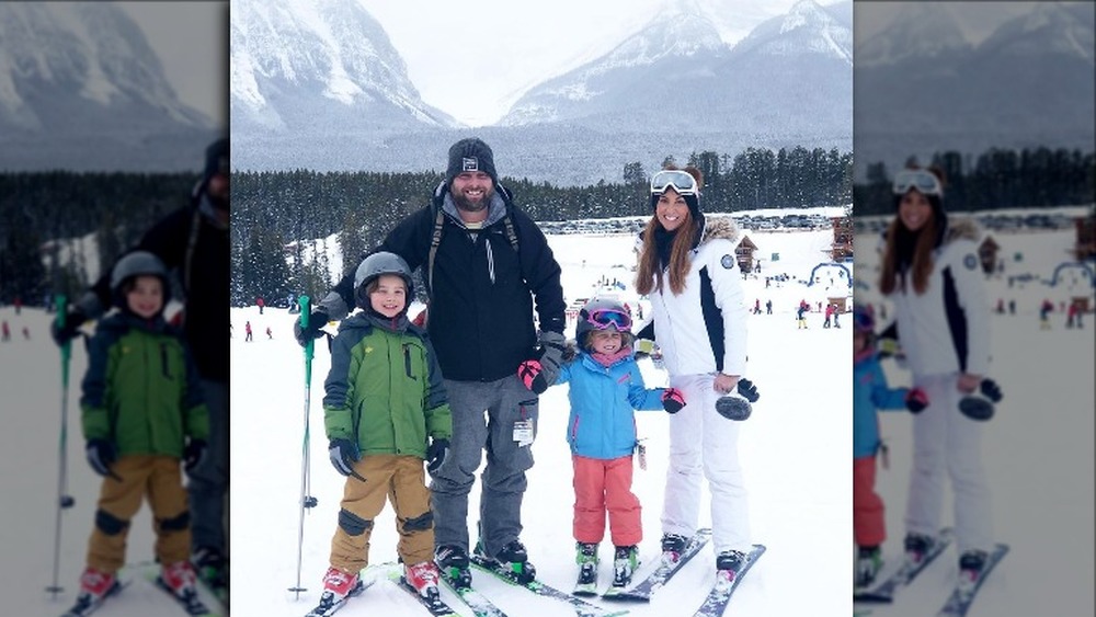 Sarah Miller with husband and kids skiing