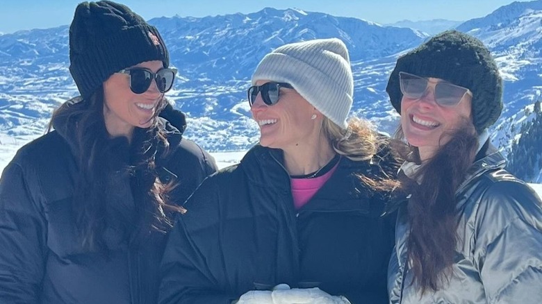 Meghan Markle smiling with friends