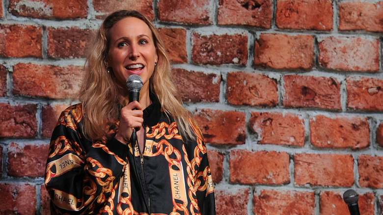 Nikki Glaser performing at stand-up comedy club