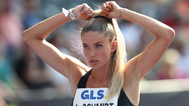 Alica Schmidt tightening her ponytail 