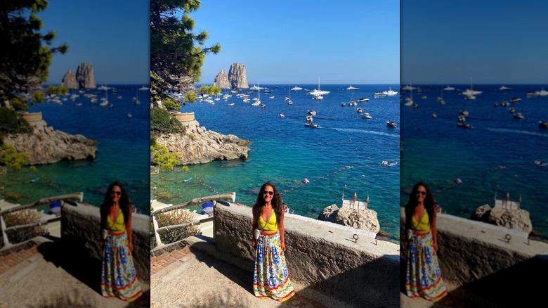 Emily Compagno posing in front of sea in Capri