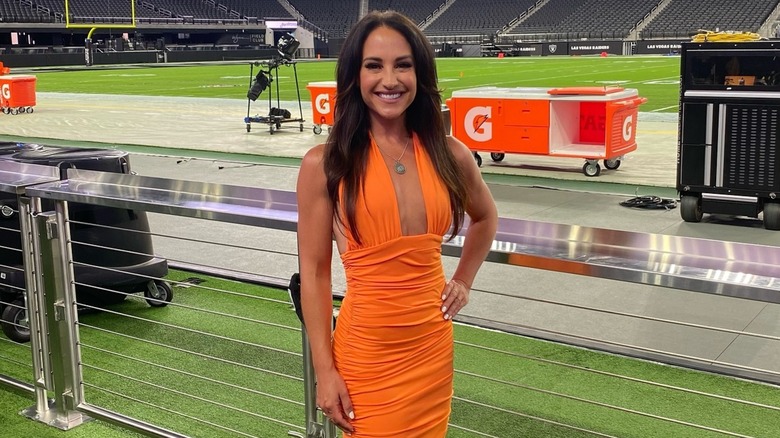 Emily Compagno posing in front of football field