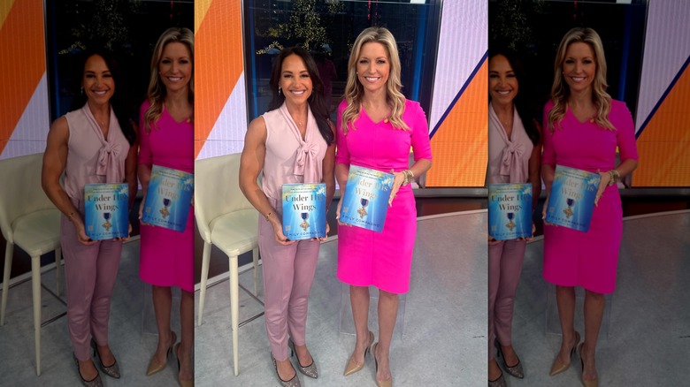 Emily Compagno and Ainsley Earhardt smiling with Compagno's book