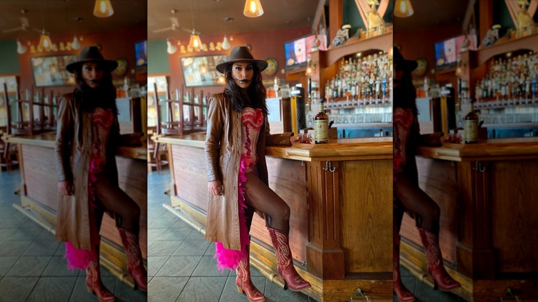 Emily Compagno posing in saloon in a Can-Can costume and face paint