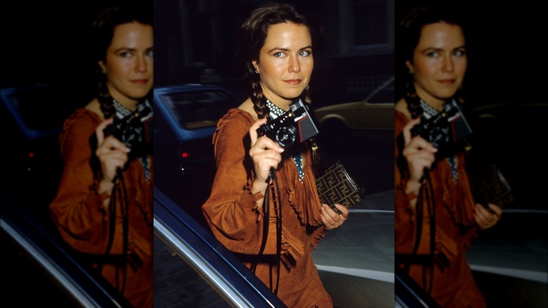 Koo Stark holding a camera