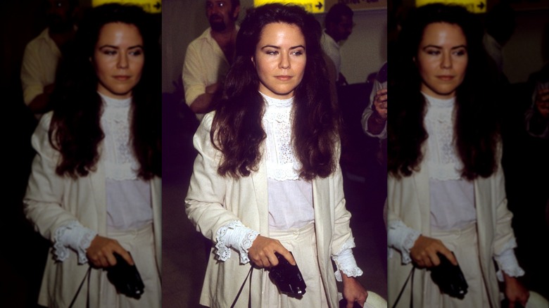 Koo Stark in a white dress