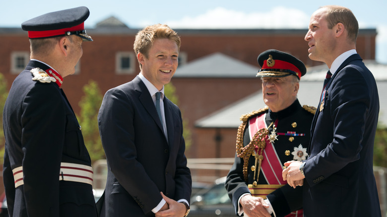 Hugh Grosvenor and Prince William with military officials 