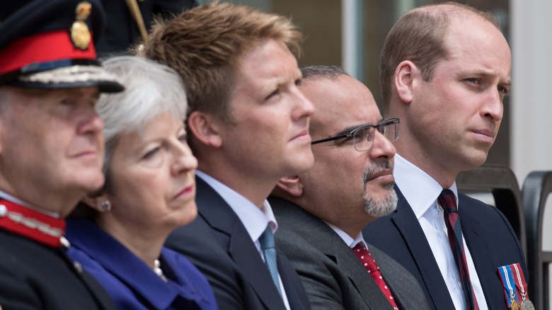 Prince William and Hugh Grosvenor sitting with political leaders