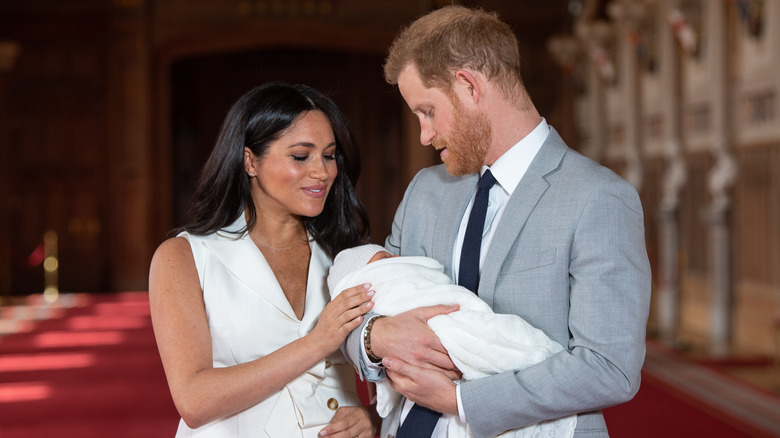 The Duke and Duchess of Sussex holding baby Archie