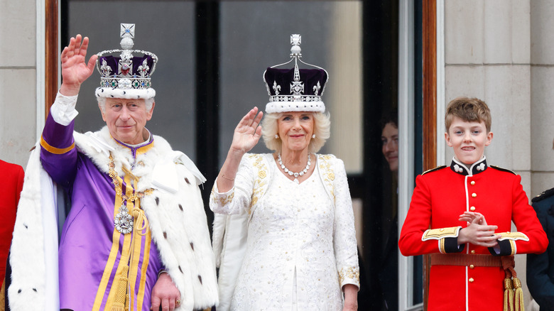 King Charles III, Camilla, Queen Consort, and Freddy Parker Bowles on the balcony of Buckingham Palace at coronation