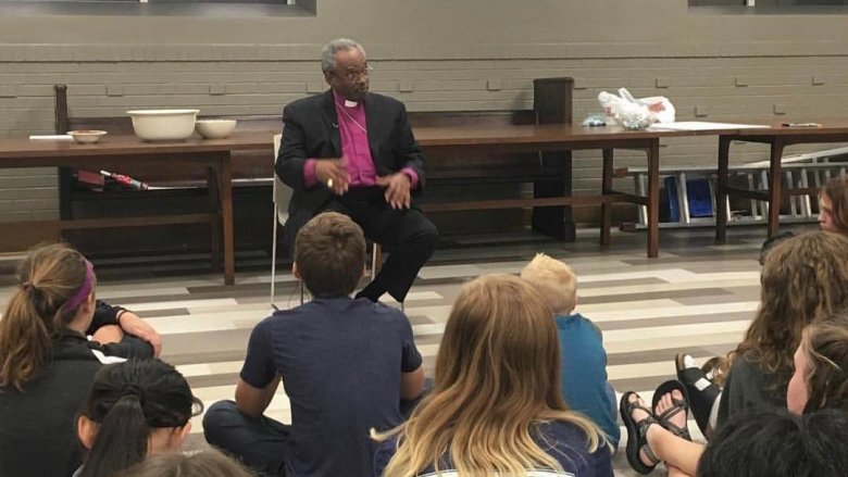 Reverend Michael Curry giving a talk to youth