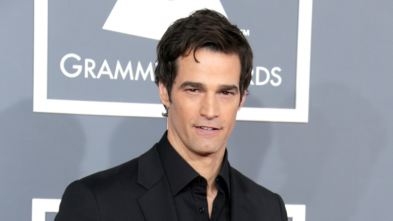 Rob Marciano posing in a black suit 