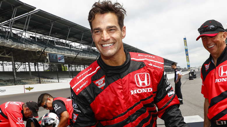 Rob Marciano smiling while reporting in the field 