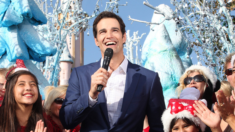 Rob Marciano holding a microphone 