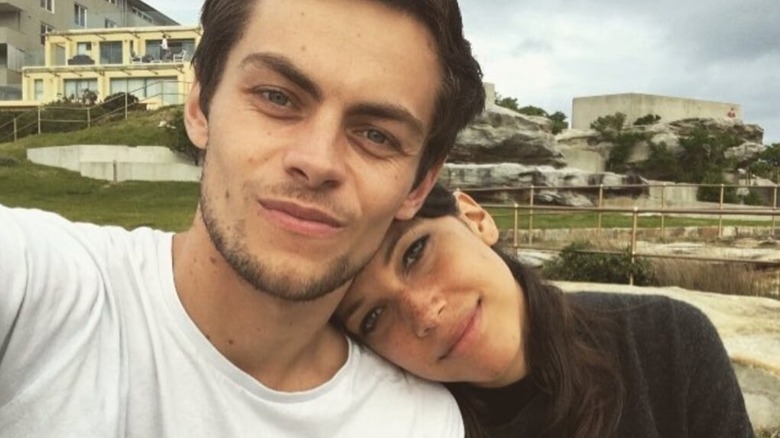 Freddy Carter wears a white T-shirt and takes a selfie with girlfriend Caroline Ford.