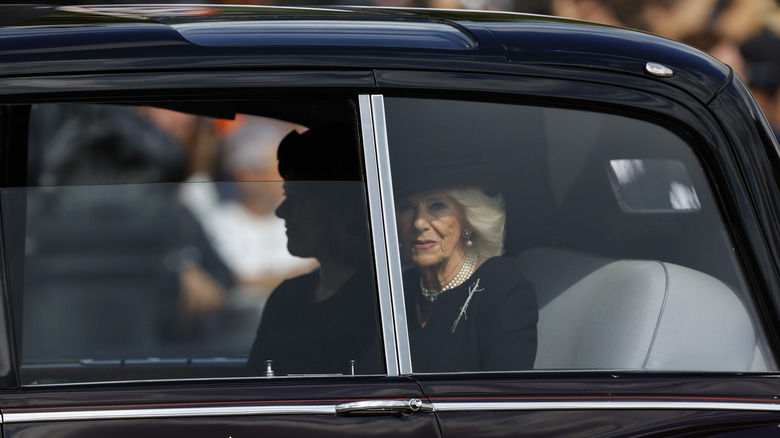 Queen Camilla and secretary in car