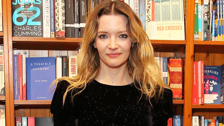 Talulah Riley in a library