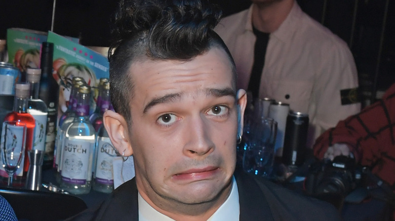 Matt Healy grimacing