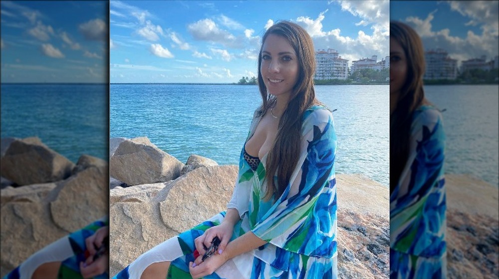 Victoria Larson sitting on a beach