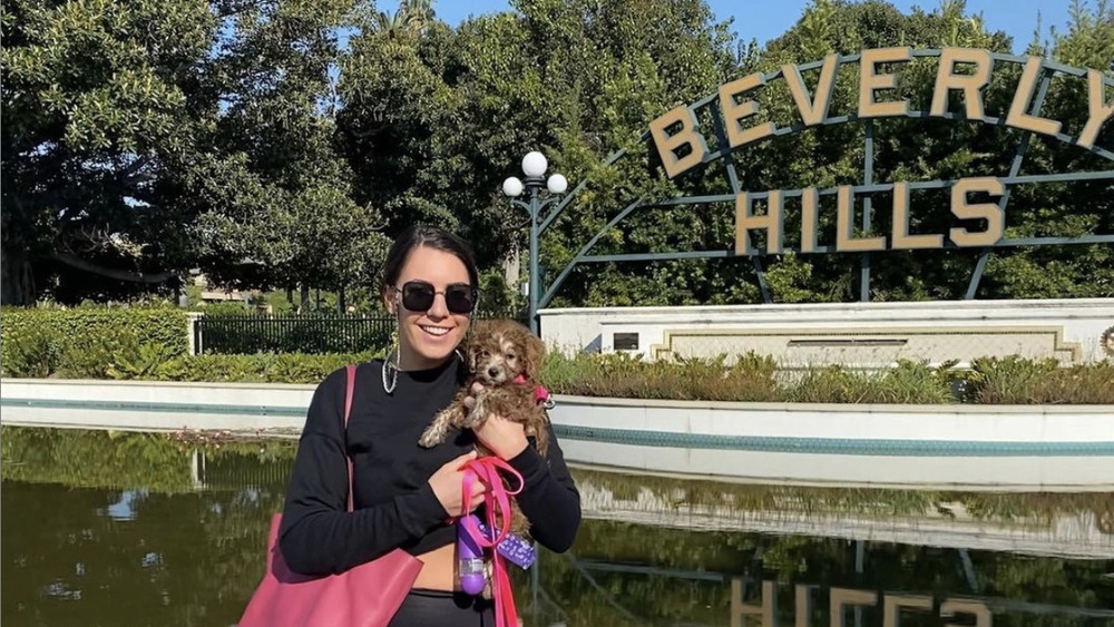 Victoria Larson with a dog in Beverly Hills