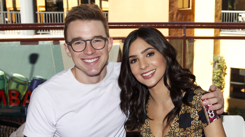 Chandler Massey and Camila Banus posing