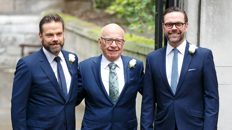 Rupert Murdoch posing with his sons